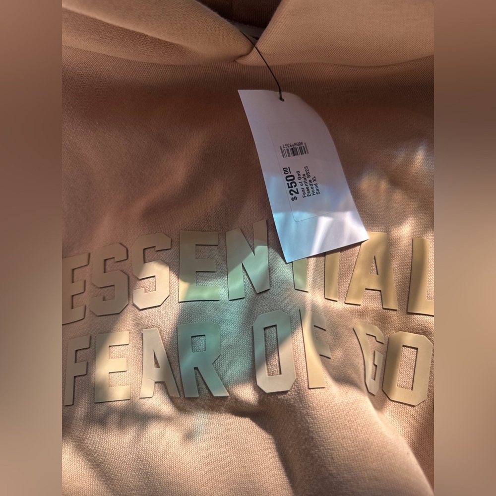 Fear of God Essentials SS23 Sand Tan Hoodie (Has a Bleach Spot) as pictured